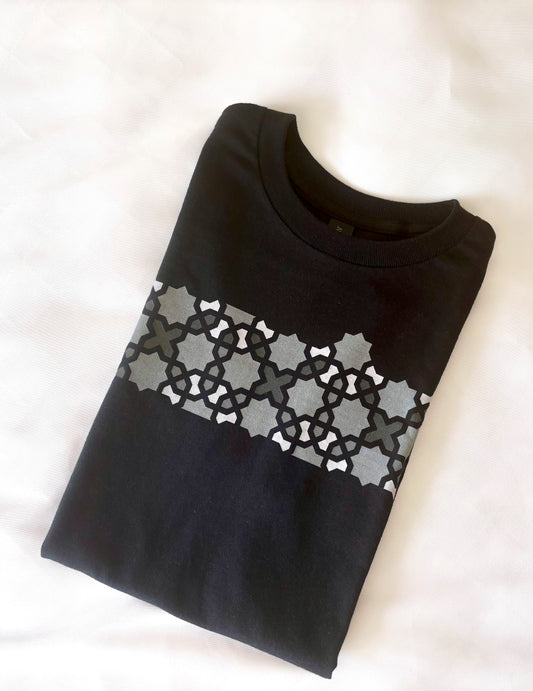 Black sweater with silver geometric pattern on a white background